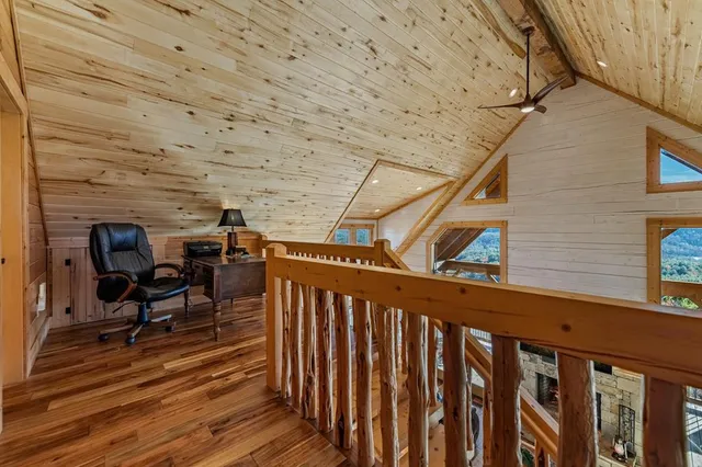 a view of house with yard and mountain view in back