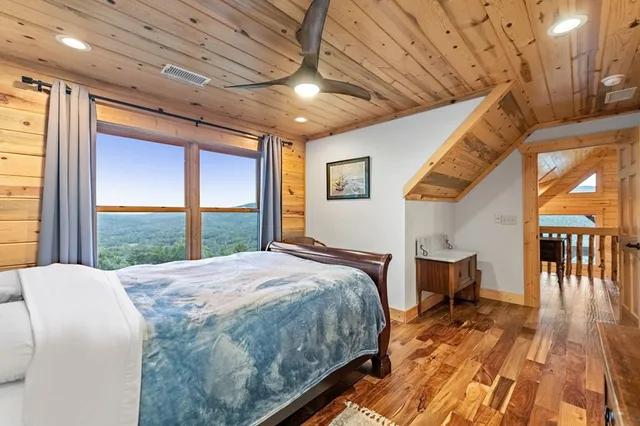 a view of a chairs and table in the balcony