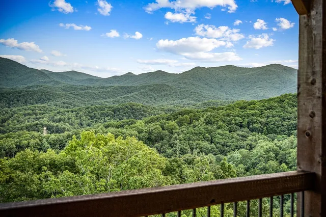a view of entryway with wooden floor and stairs