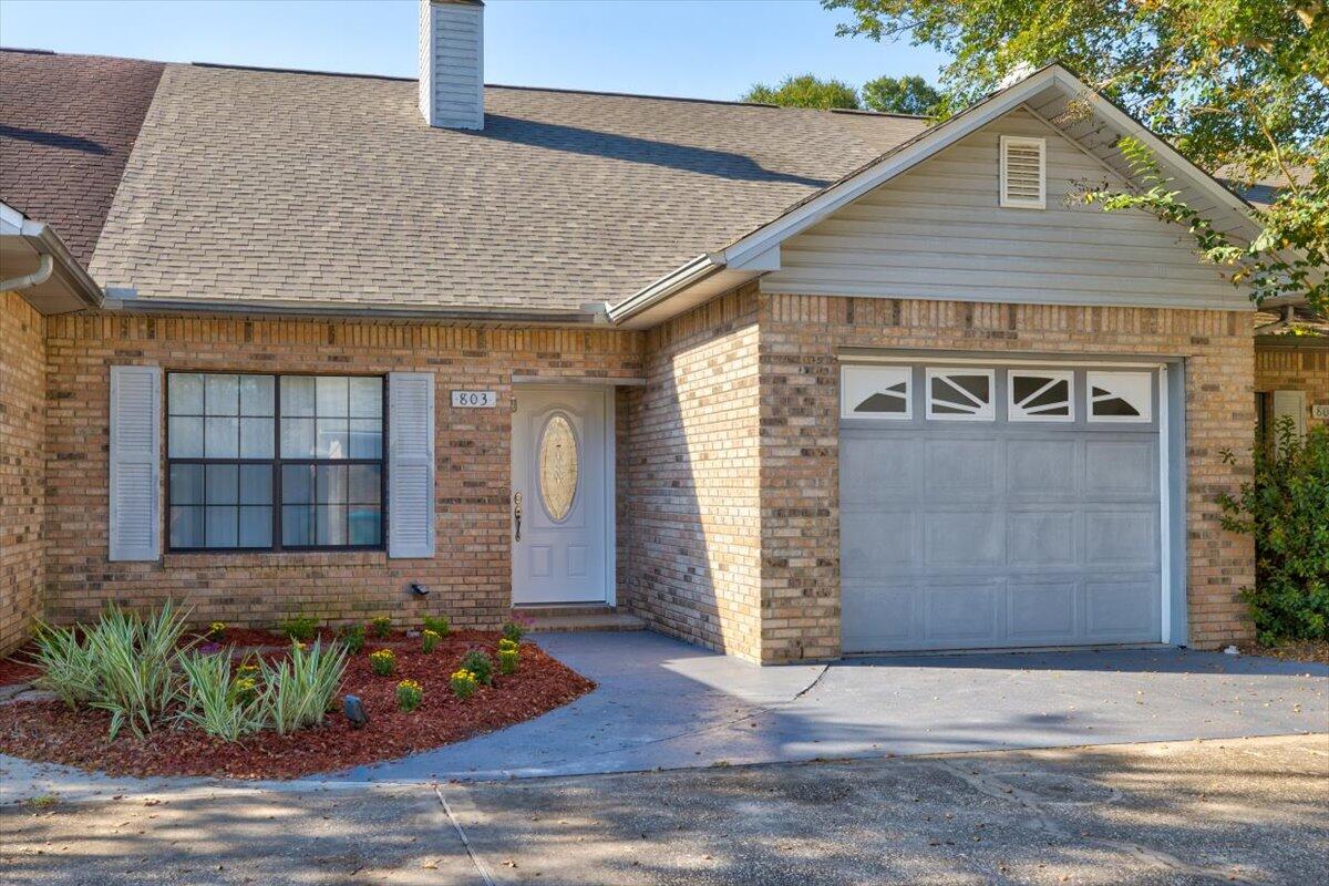 803 Valley Road Crestview, FL 32539 - Photo 1 of 22 a front view of a house with garden