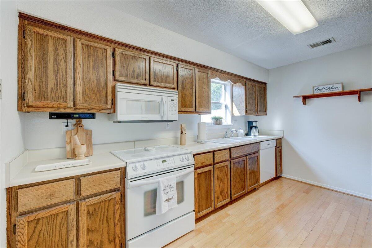 803 Valley Road Crestview, FL 32539 - Photo 13 of 22 a kitchen with stainless steel appliances granite countertop a sink stove and cabinets