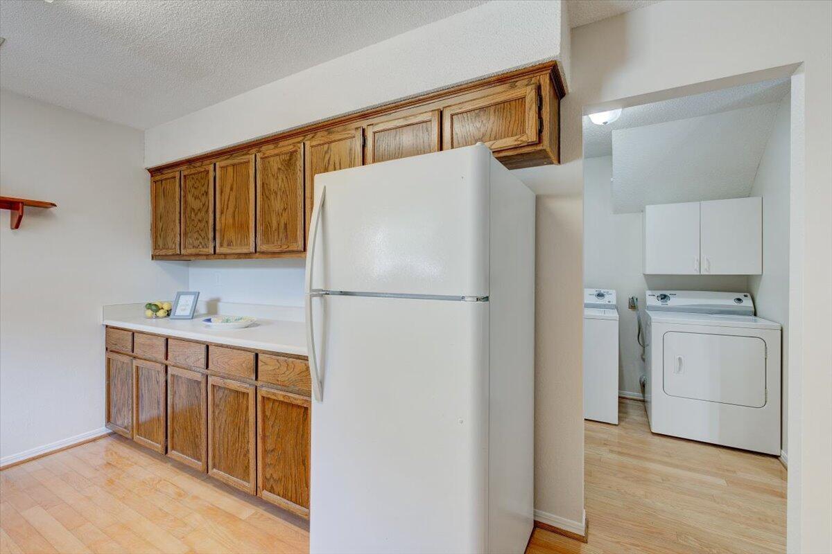 803 Valley Road Crestview, FL 32539 - Photo 14 of 22 a kitchen with white cabinets and white appliances