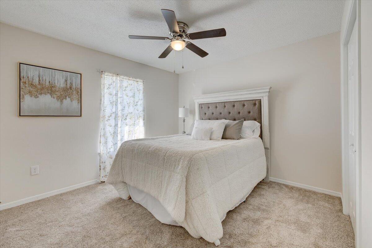 803 Valley Road Crestview, FL 32539 - Photo 18 of 22 a bed room with a bed and a window