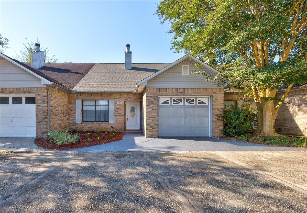 803 Valley Road Crestview, FL 32539 - Photo 4 of 22 a front view of a house with a yard and garage