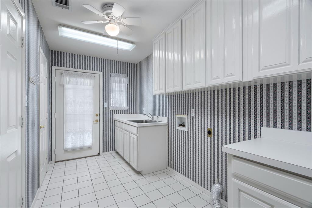 1317 Timber Ridge Road Weatherford, TX 76088 - Photo 14 of 40 a room with storage and utility