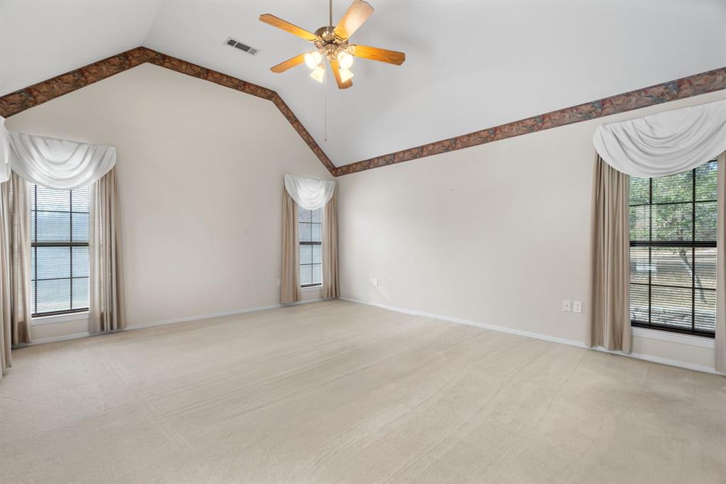 1317 Timber Ridge Road Weatherford, TX 76088 - Photo 21 of 40 a view of an empty room with a window