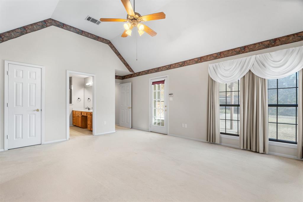 1317 Timber Ridge Road Weatherford, TX 76088 - Photo 23 of 40 a view of empty room with ceiling fan