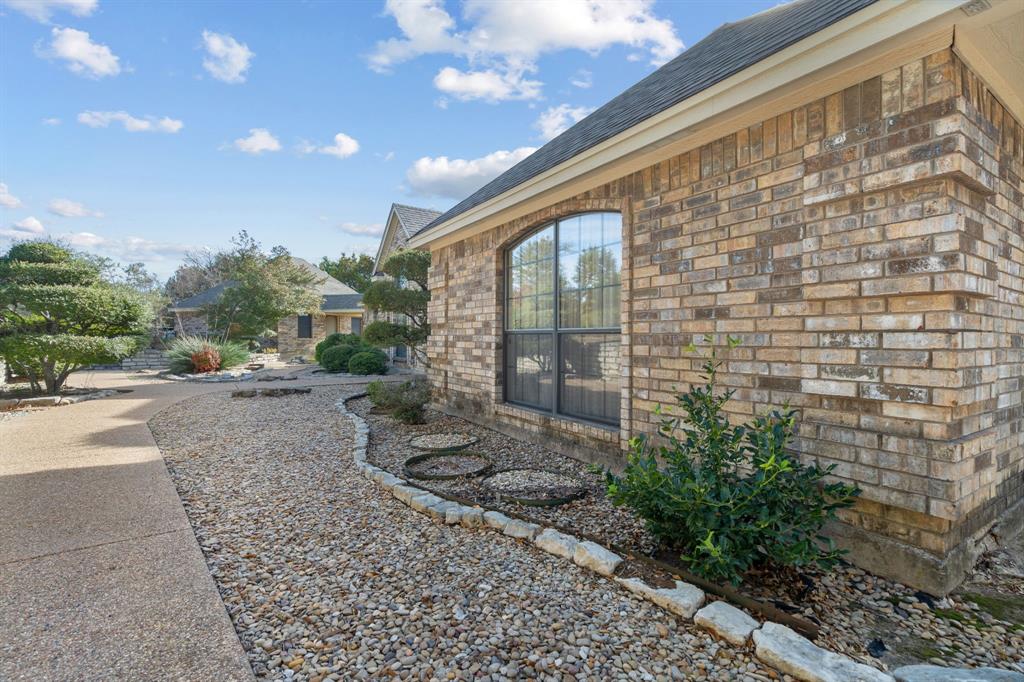 1317 Timber Ridge Road Weatherford, TX 76088 - Photo 33 of 40 a view of a pathway with a building in the background