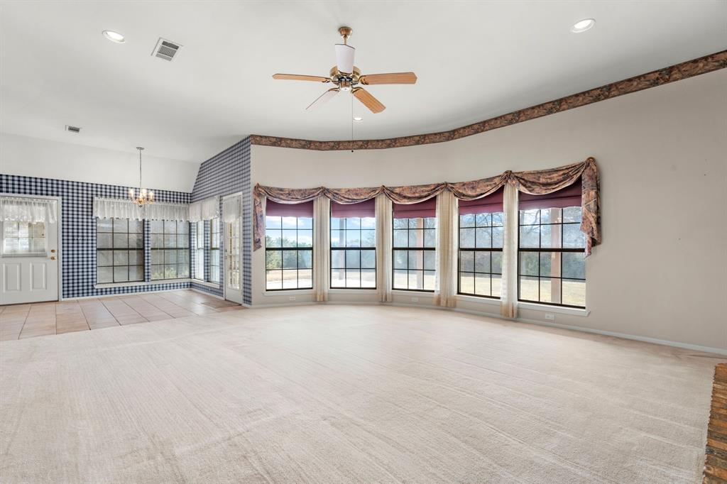 1317 Timber Ridge Road Weatherford, TX 76088 - Photo 6 of 40 a view of an empty room with windows