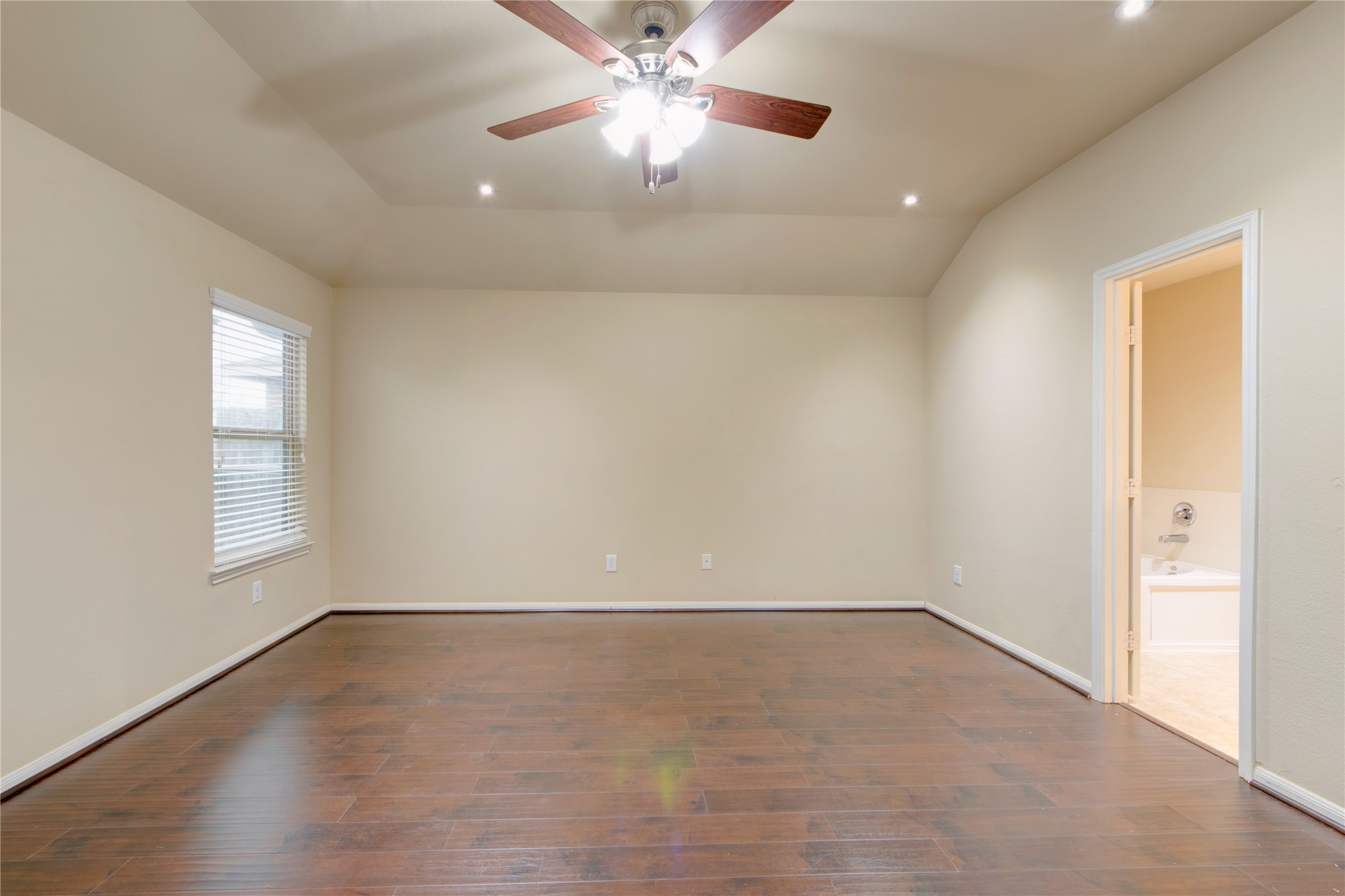 9322 Limestone Ranch Lane Richmond, TX 77407 - Photo 18 of 40 wooden floor in an empty room with a window