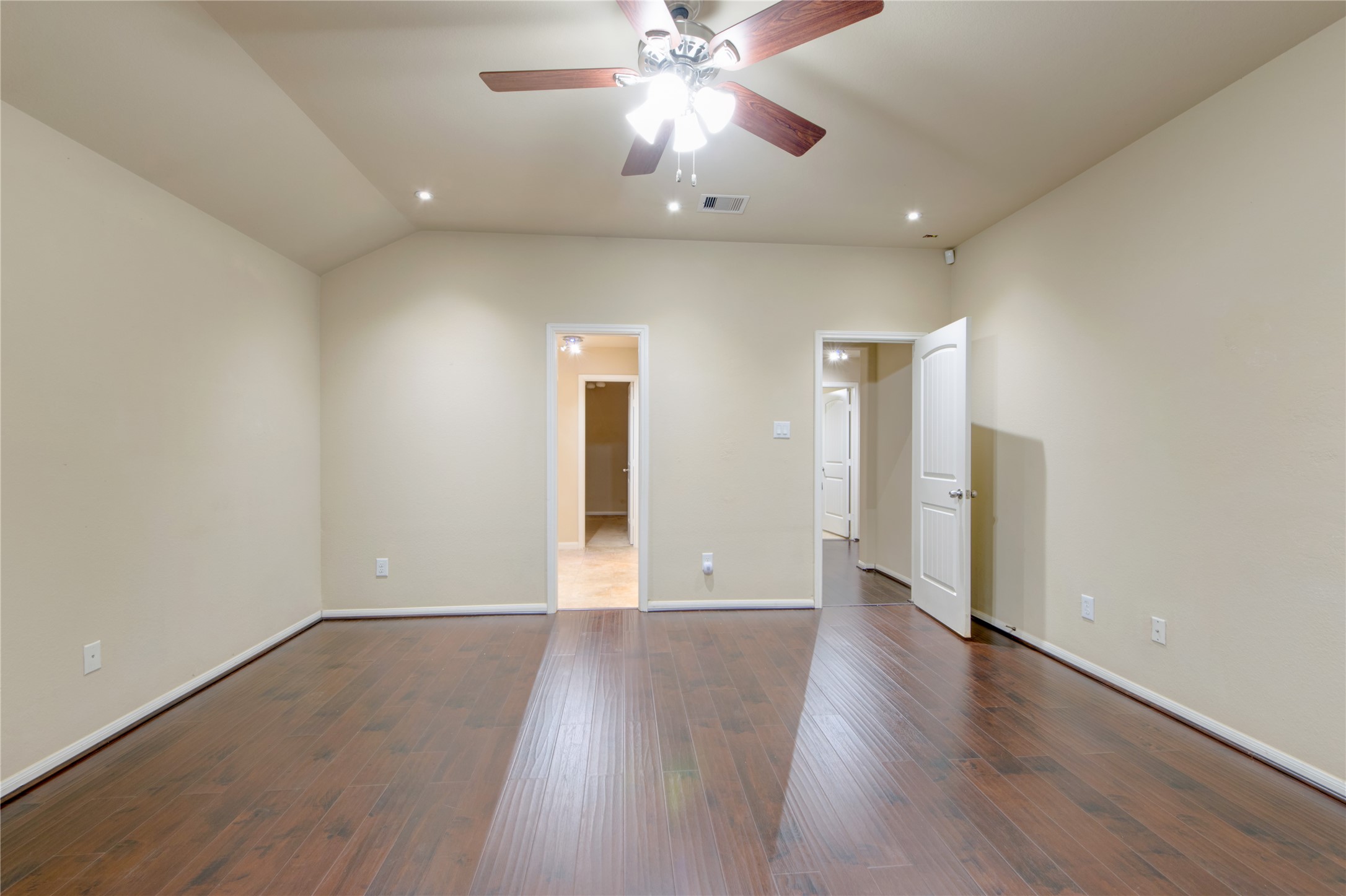 9322 Limestone Ranch Lane Richmond, TX 77407 - Photo 19 of 40 wooden floor in an empty room with a window