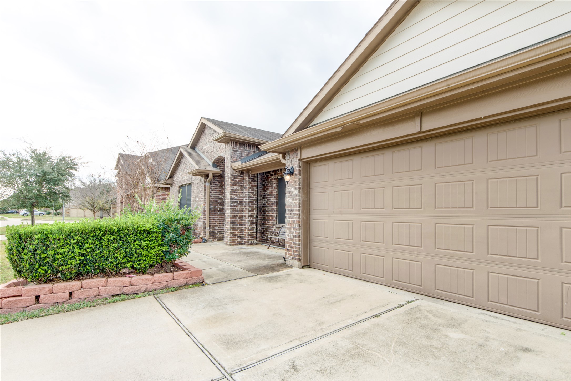 9322 Limestone Ranch Lane Richmond, TX 77407 - Photo 2 of 40 a front view of a house with garden