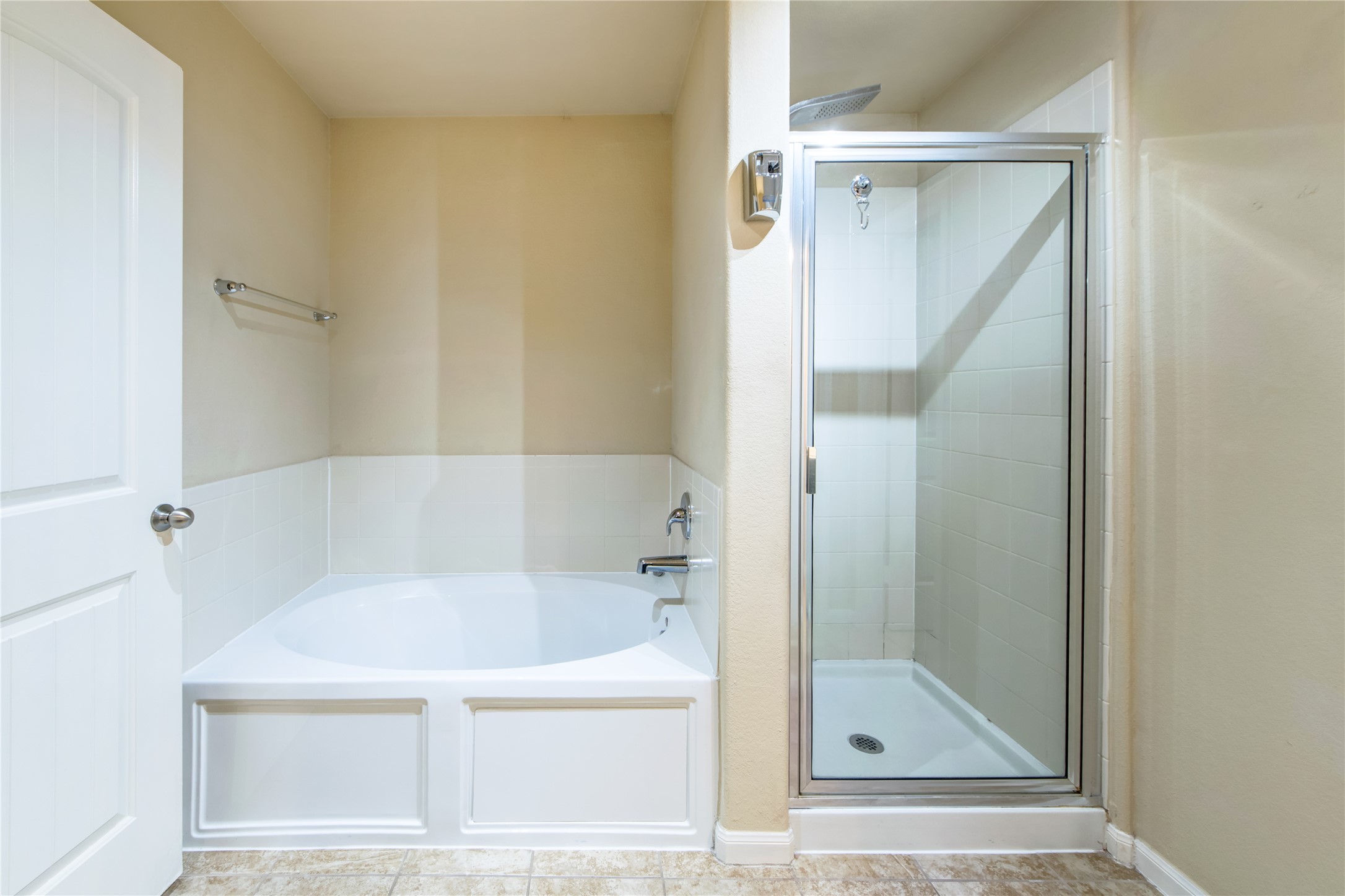 9322 Limestone Ranch Lane Richmond, TX 77407 - Photo 22 of 40 a white bath tub sitting next to a shower