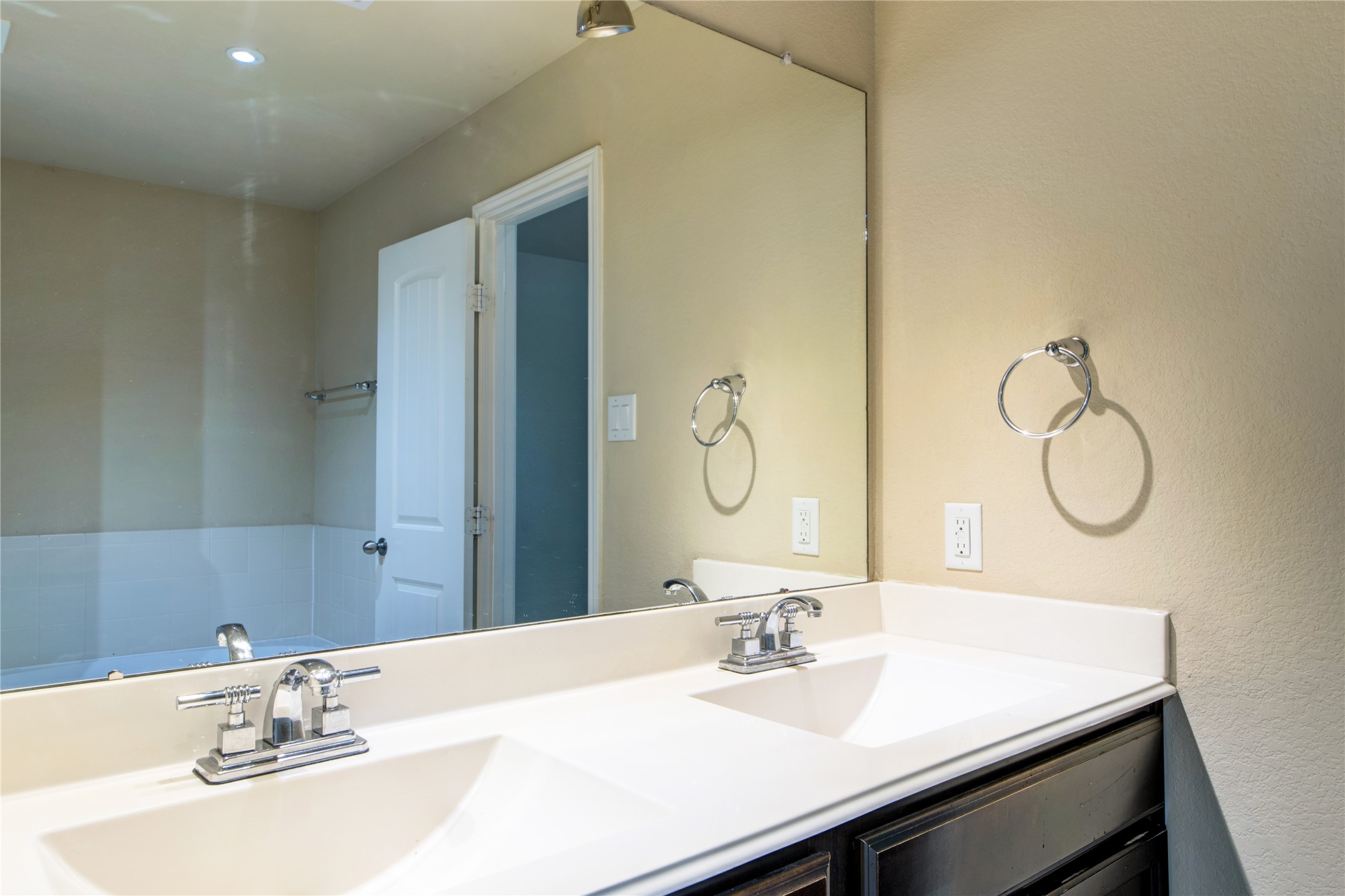 9322 Limestone Ranch Lane Richmond, TX 77407 - Photo 23 of 40 a bathroom with a sink vanity and a mirror