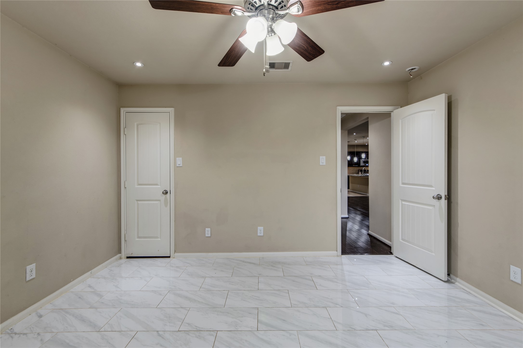 9322 Limestone Ranch Lane Richmond, TX 77407 - Photo 27 of 40 a view of an empty room and chandelier fan