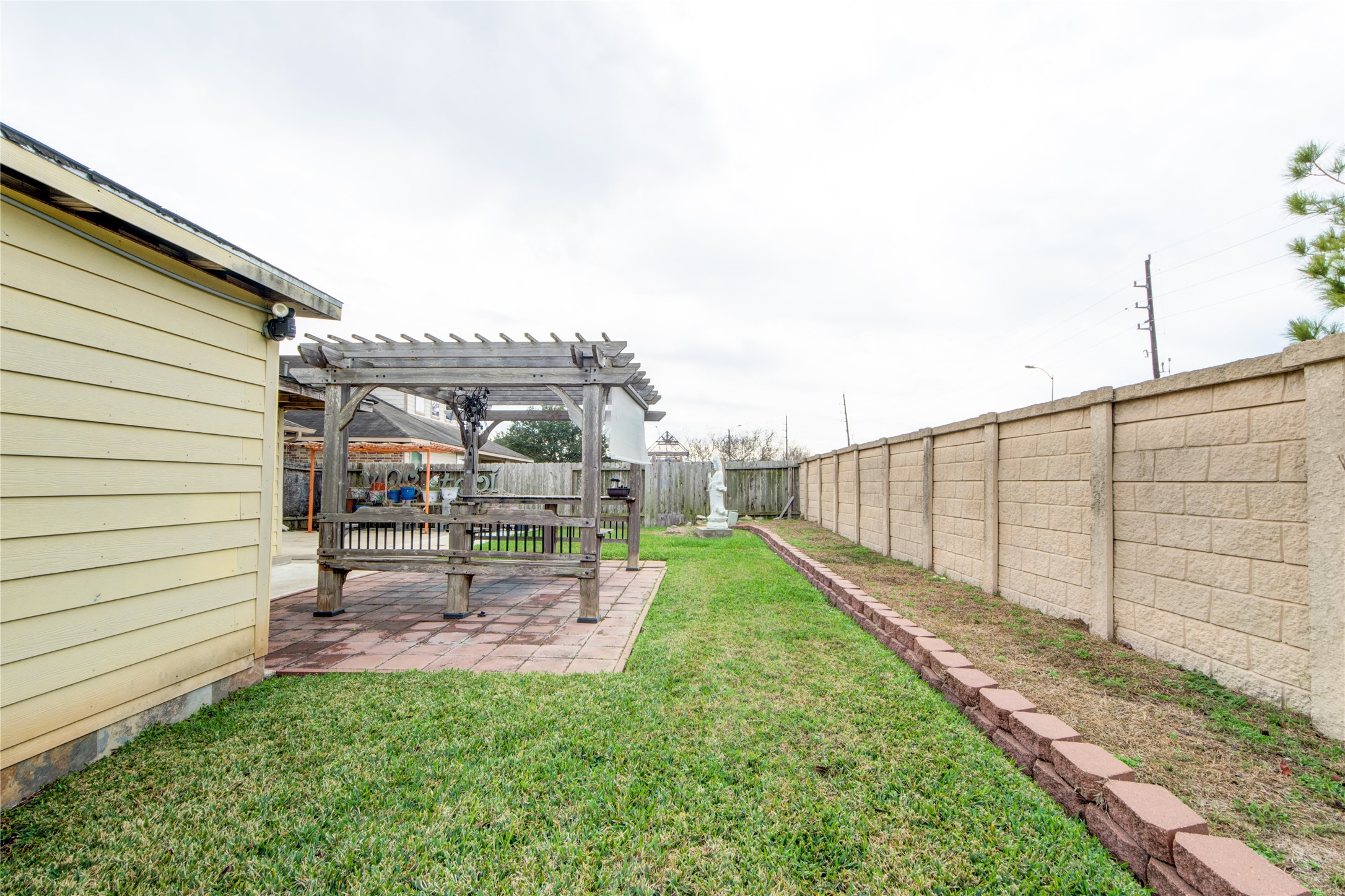 9322 Limestone Ranch Lane Richmond, TX 77407 - Photo 35 of 40 a view of a backyard with sitting area
