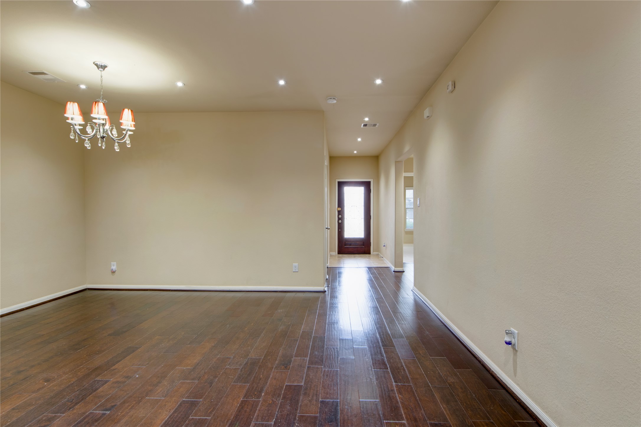 9322 Limestone Ranch Lane Richmond, TX 77407 - Photo 6 of 40 wooden floor in an empty room with a window
