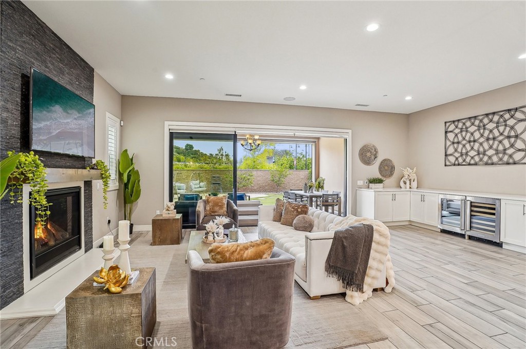 a living room with fireplace furniture and a flat screen tv