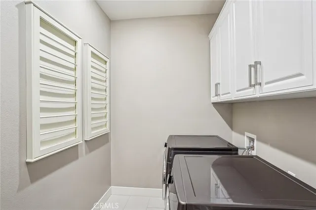 a bedroom with furniture and a chandelier