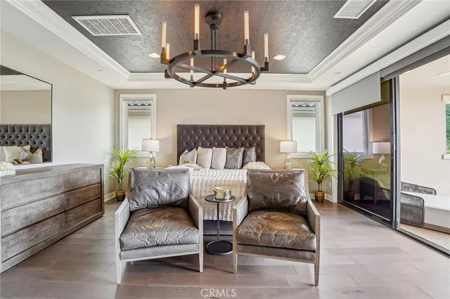 a spacious bedroom with a bed and ceiling fan