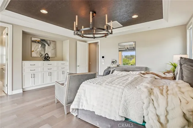 a large bathroom with a tub sink and mirror