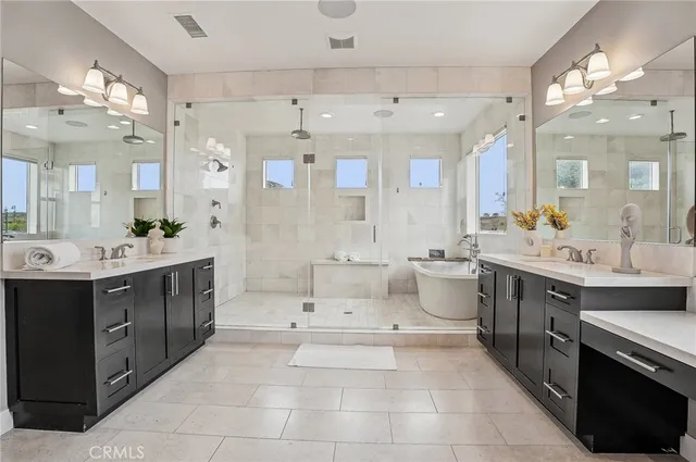 a white bath tub sitting next to a white sink