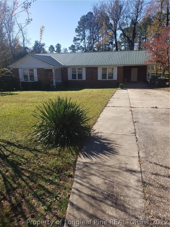 315 Old Farm Road Raeford, NC 28376 - Photo 1 of 13 a view of a house with a yard