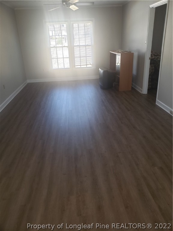 315 Old Farm Road Raeford, NC 28376 - Photo 12 of 13 an empty room with wooden floor and windows