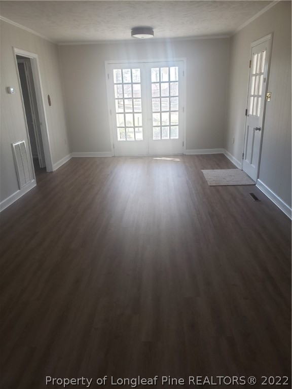 315 Old Farm Road Raeford, NC 28376 - Photo 13 of 13 an empty room with wooden floor and windows