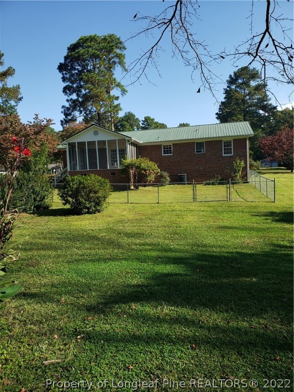 315 Old Farm Road Raeford, NC 28376 - Photo 2 of 13 a front view of a house with a yard