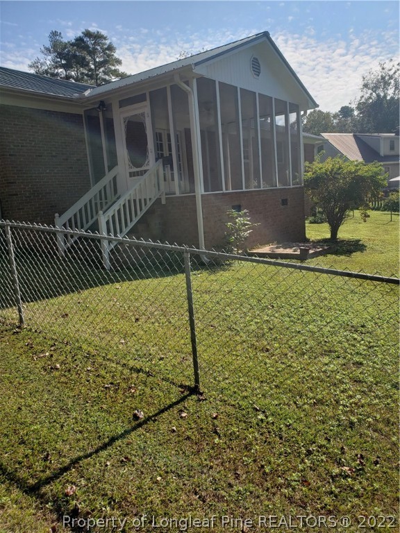 315 Old Farm Road Raeford, NC 28376 - Photo 3 of 13 a front view of a house with a yard