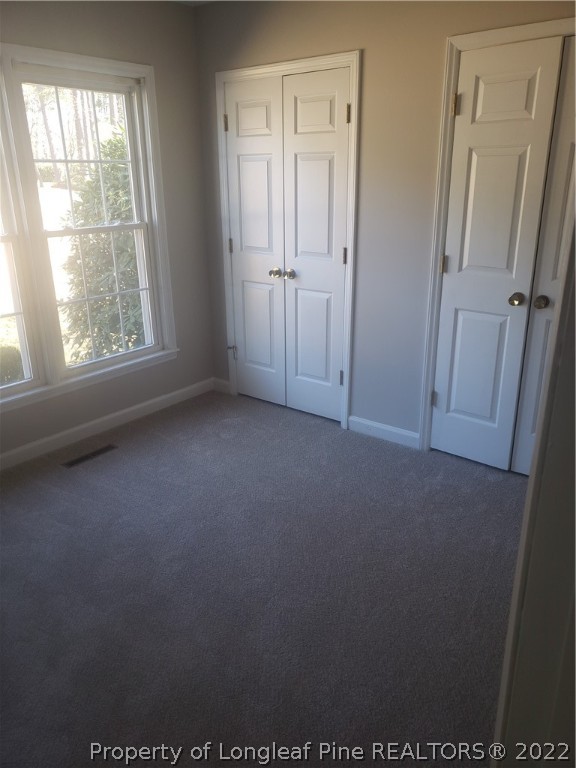 315 Old Farm Road Raeford, NC 28376 - Photo 7 of 13 an empty room with windows