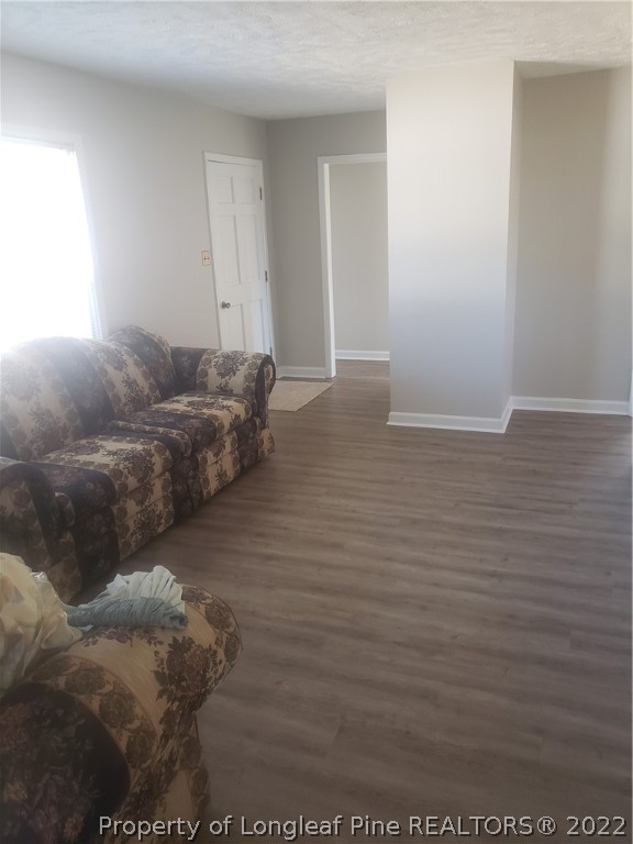 315 Old Farm Road Raeford, NC 28376 - Photo 8 of 13 a living room with furniture and a wooden floor