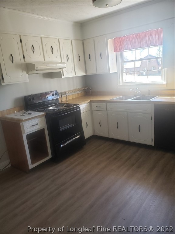 315 Old Farm Road Raeford, NC 28376 - Photo 10 of 13 a kitchen with granite countertop a stove a sink and a microwave