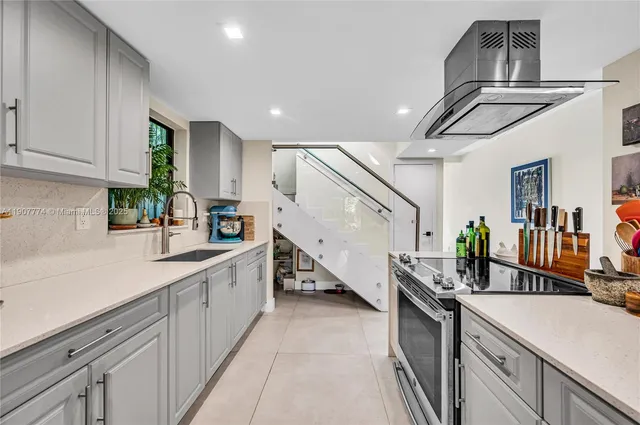 a kitchen with sink cabinets and window