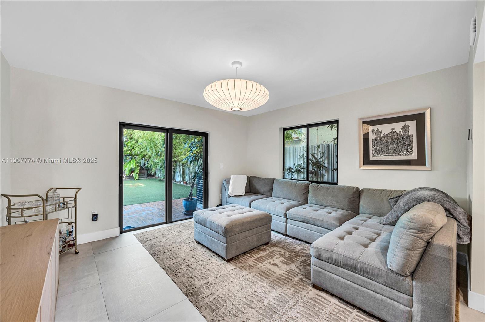 2965 Southwest 25th Terrace, Unit 2965 Miami, FL 33133 - Photo 14 of 40 a living room with furniture and a large window