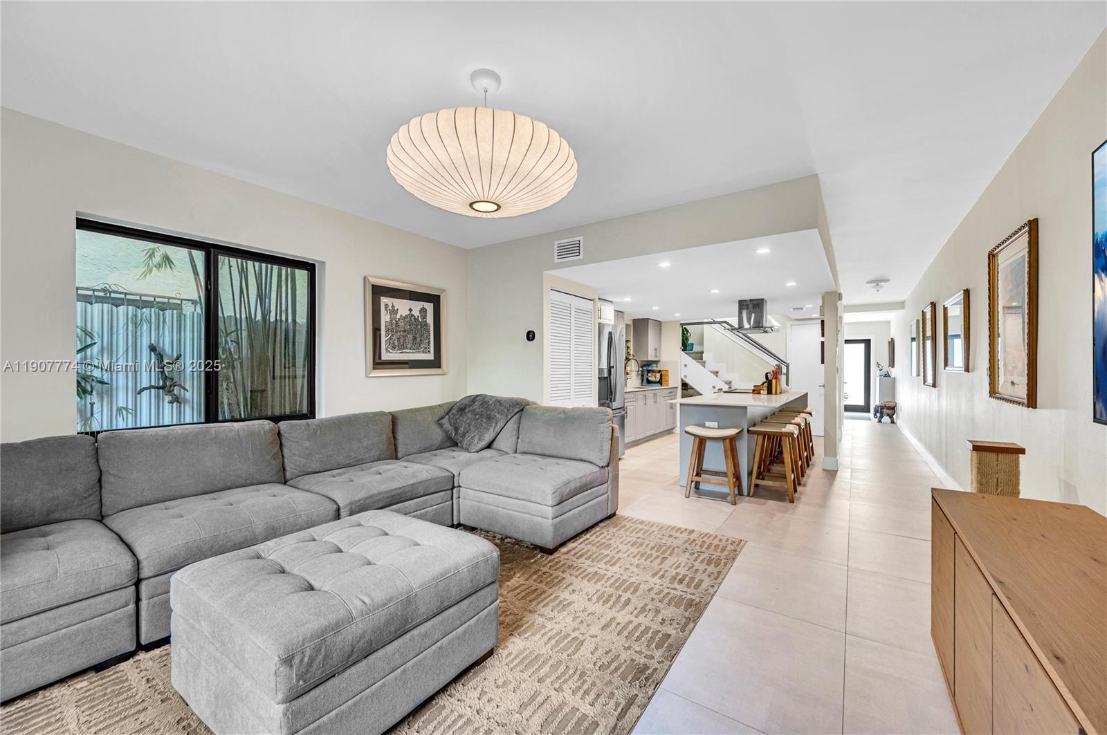 2965 Southwest 25th Terrace, Unit 2965 Miami, FL 33133 - Photo 15 of 40 a living room with furniture and a large window