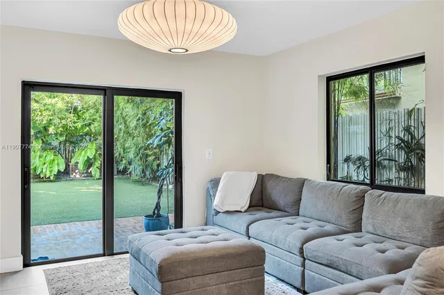 a living room with furniture and a window