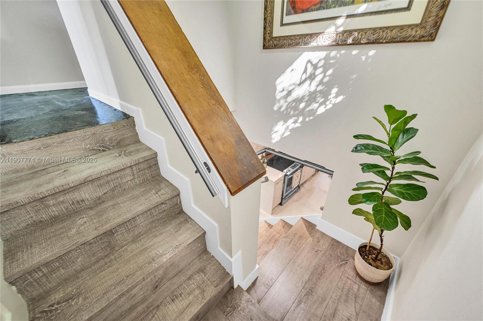 2965 Southwest 25th Terrace, Unit 2965 Miami, FL 33133 - Photo 22 of 40 a vase with flowers sitting on a table with wooden floor