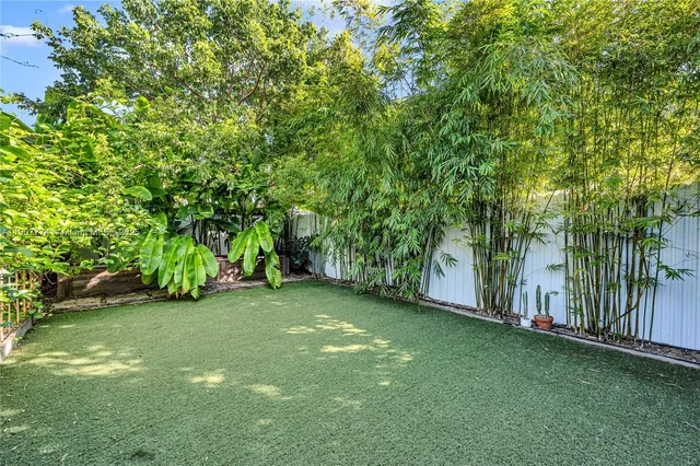 a view of a lush green space