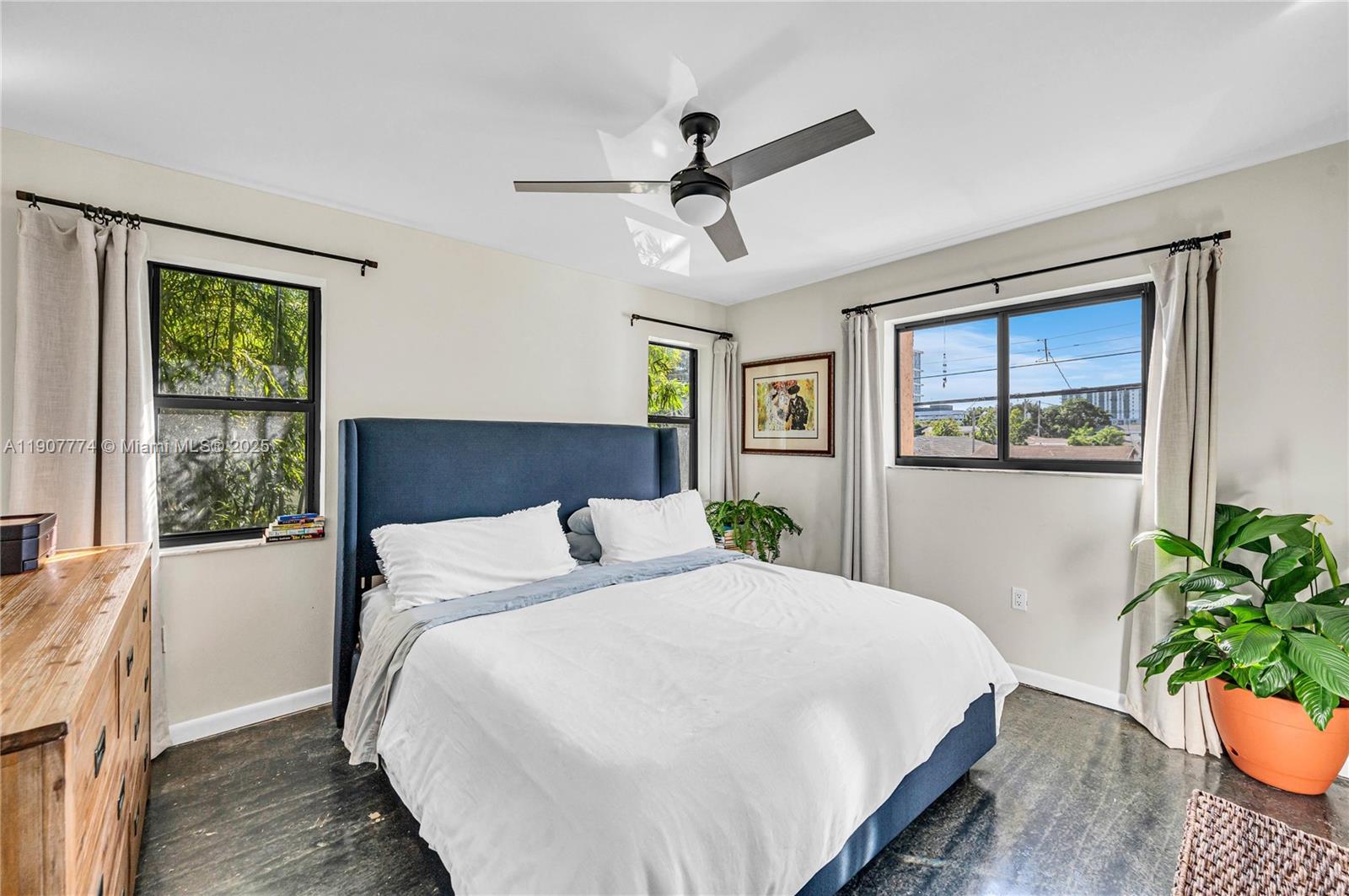 2965 Southwest 25th Terrace, Unit 2965 Miami, FL 33133 - Photo 31 of 40 a bedroom with a large bed and a window