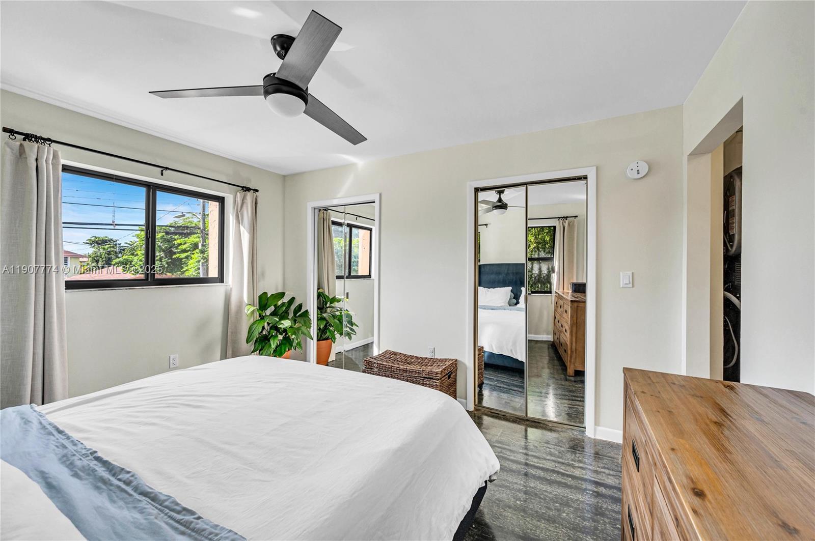 2965 Southwest 25th Terrace, Unit 2965 Miami, FL 33133 - Photo 32 of 40 a bedroom with a bed and a dresser