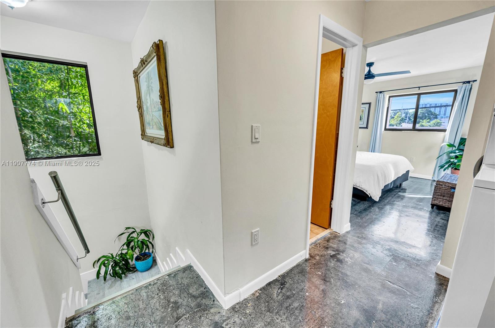 2965 Southwest 25th Terrace, Unit 2965 Miami, FL 33133 - Photo 33 of 40 a view of hallway with furniture and a potted plant