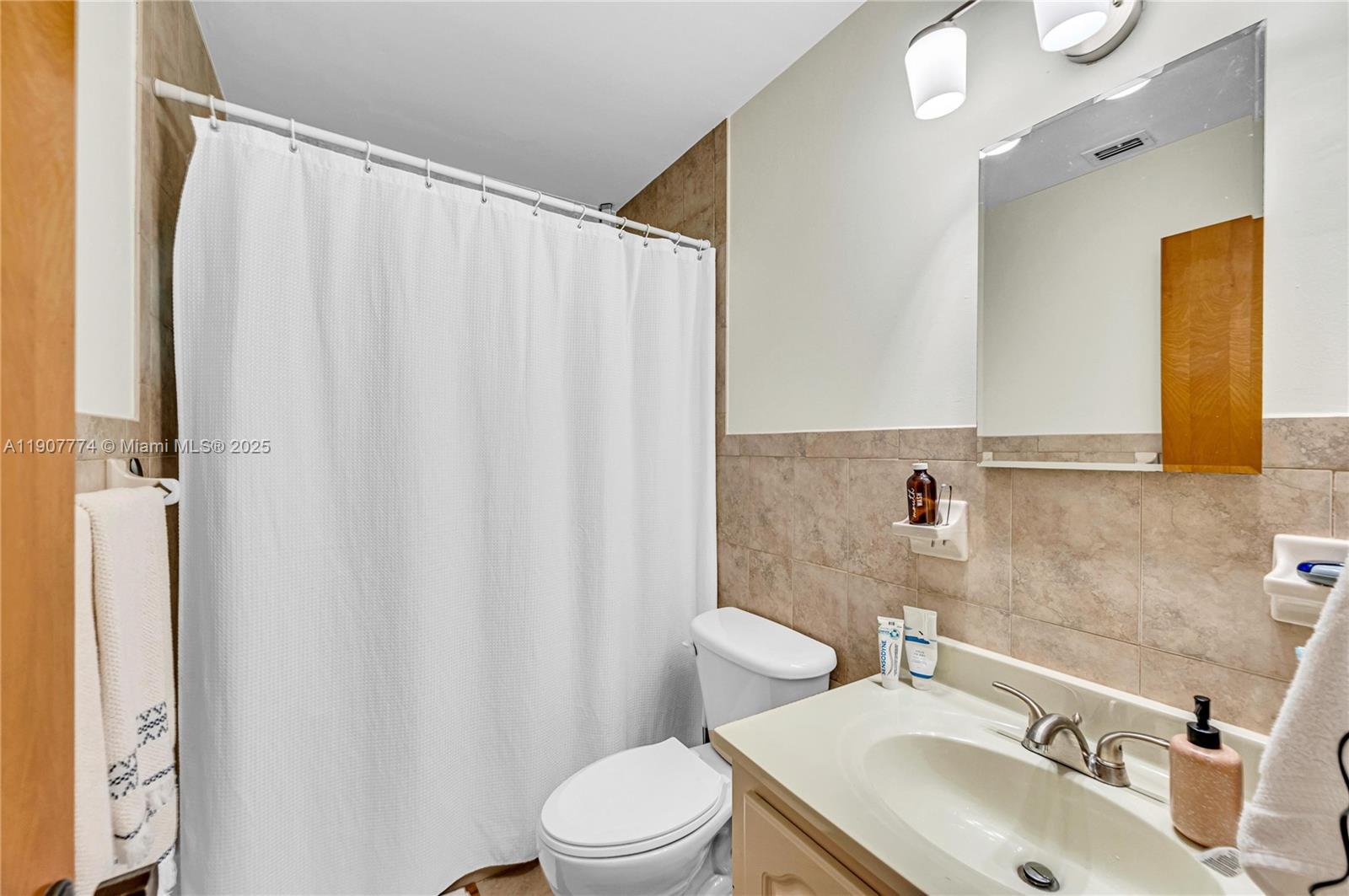 2965 Southwest 25th Terrace, Unit 2965 Miami, FL 33133 - Photo 36 of 40 a bathroom with a sink toilet and shower