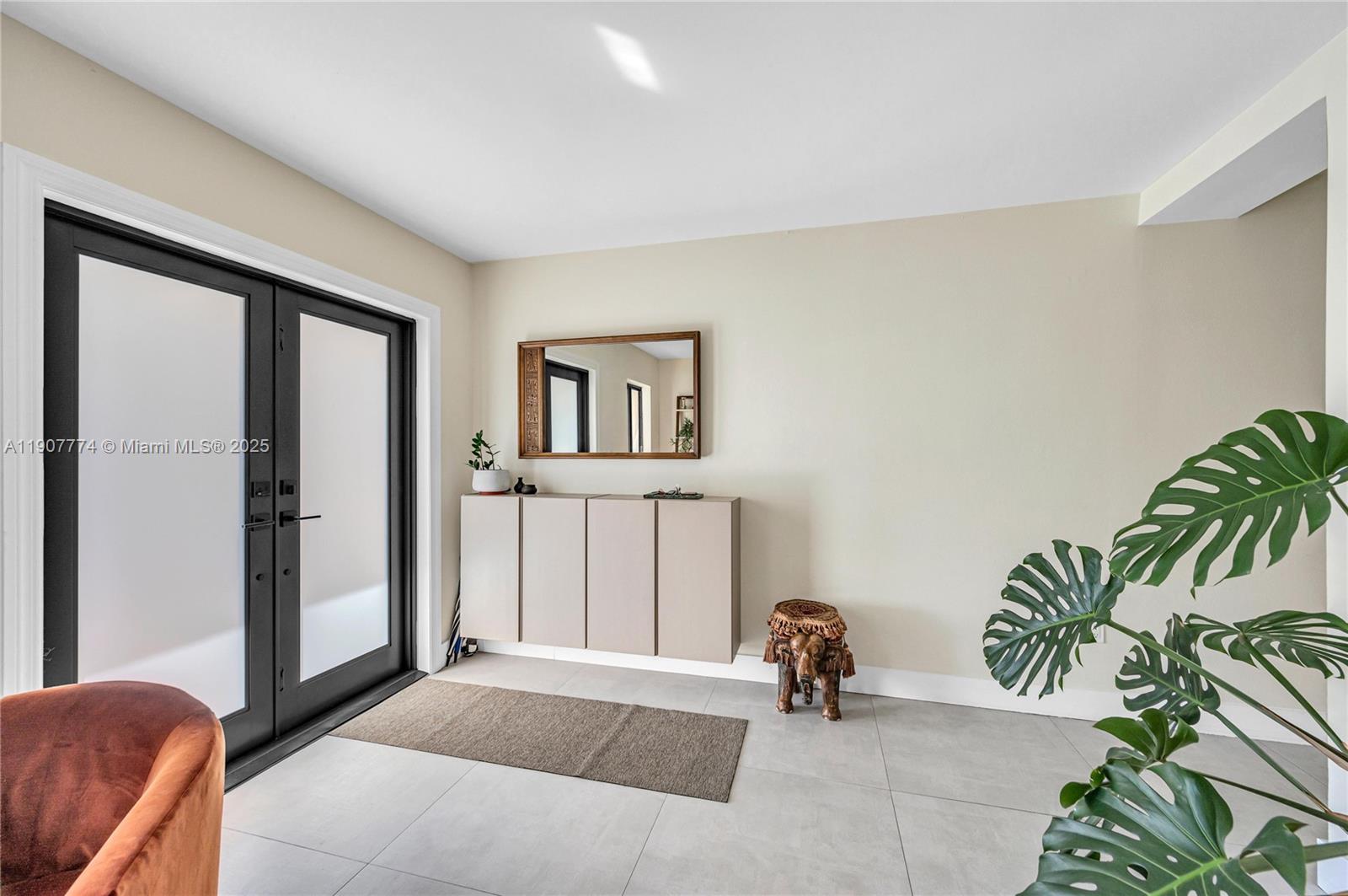 2965 Southwest 25th Terrace, Unit 2965 Miami, FL 33133 - Photo 4 of 40 a living room with furniture and a potted plant
