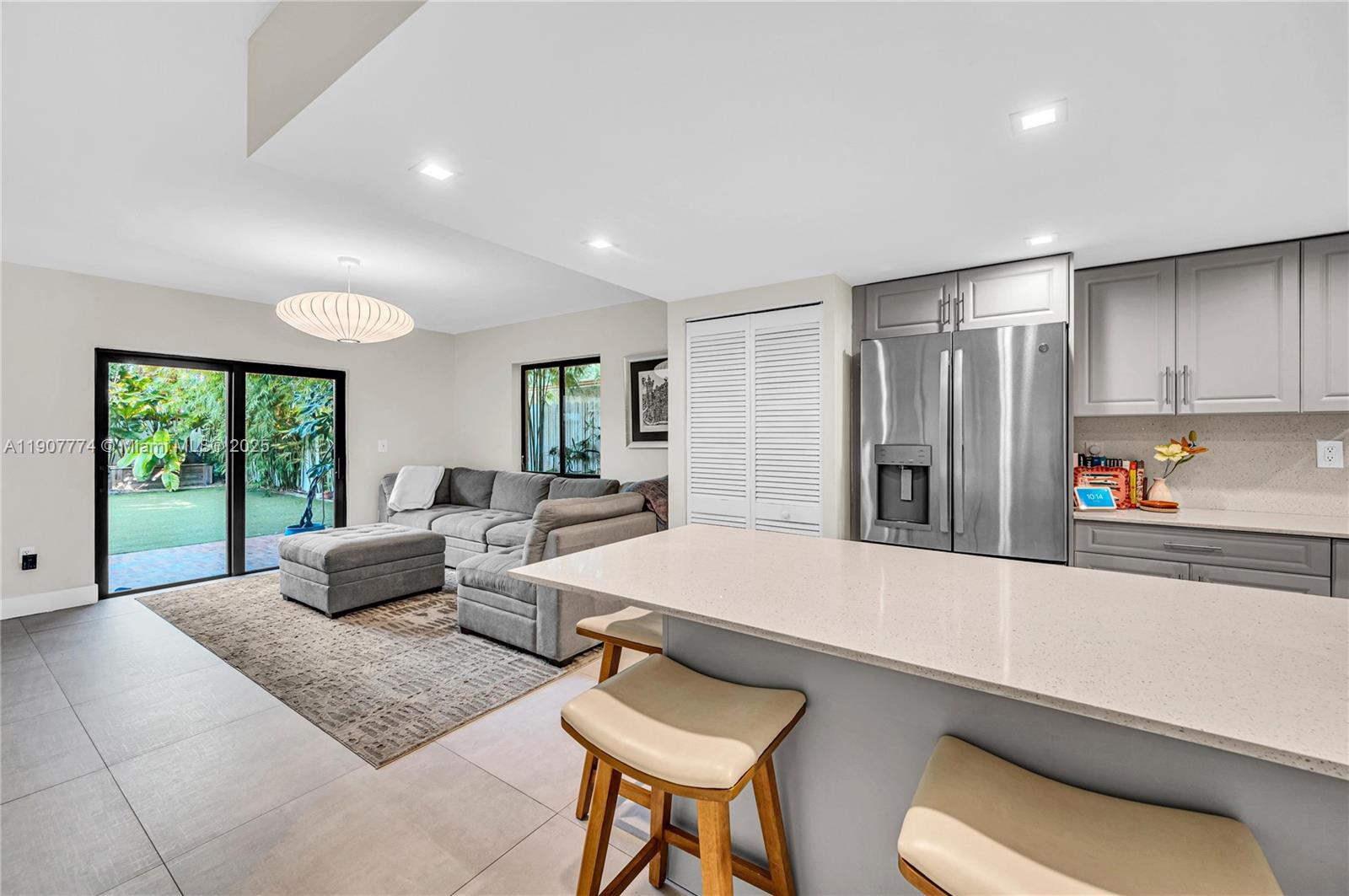 2965 Southwest 25th Terrace, Unit 2965 Miami, FL 33133 - Photo 7 of 40 a living room with furniture and a large window