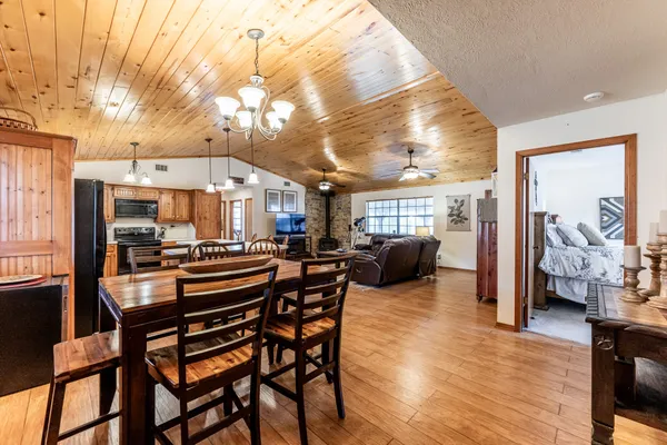 a very nice looking room with a large window and furniture