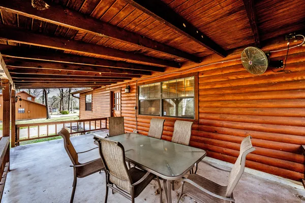 a view of a chairs and table in the patio