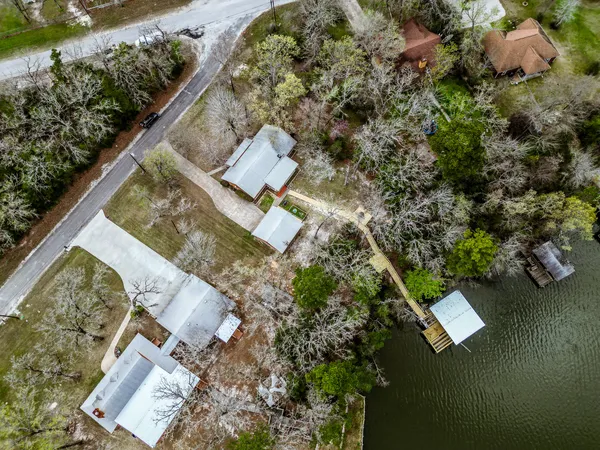 an aerial view of a house with outdoor space