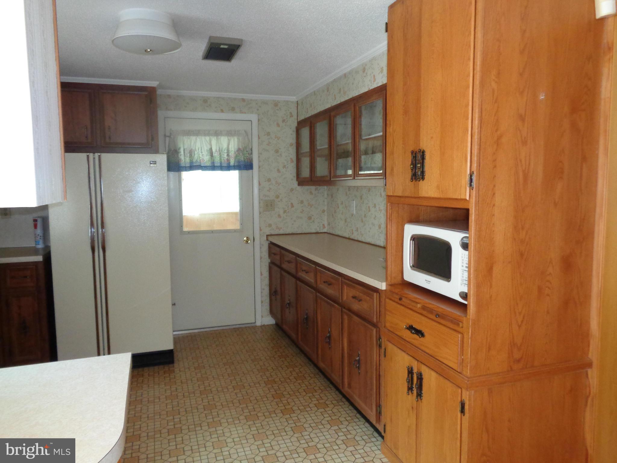 4307 York Road, Unit 1 Manchester, MD 21102 - Photo 17 of 30 a kitchen with stainless steel appliances a microwave and a sink